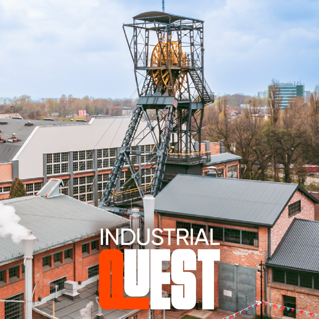 Wieża Carnall i zabudowania kopalni na powierzchni wraz z napisem Industrial quest
